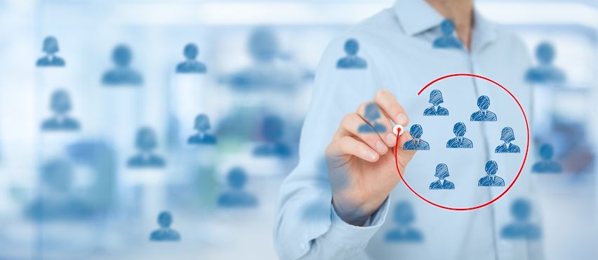 Person circling icons on a board, symbolizing audience segmentation for personalized email marketing