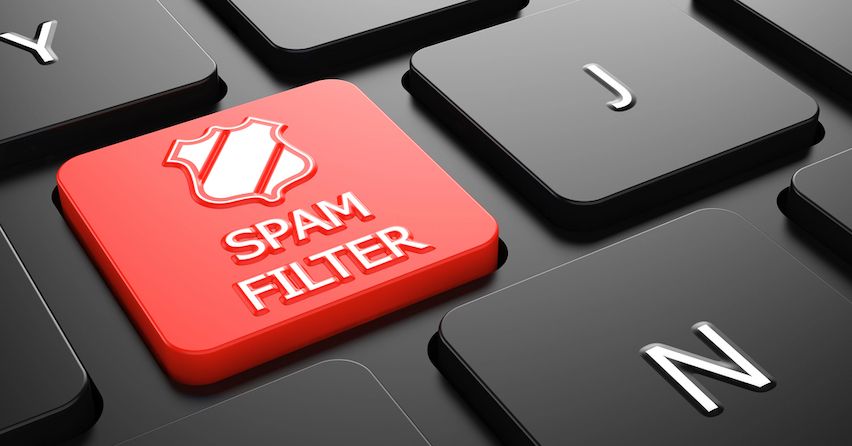 Red 'Spam Filter' shield icon on a keyboard button, symbolizing email spam prevention