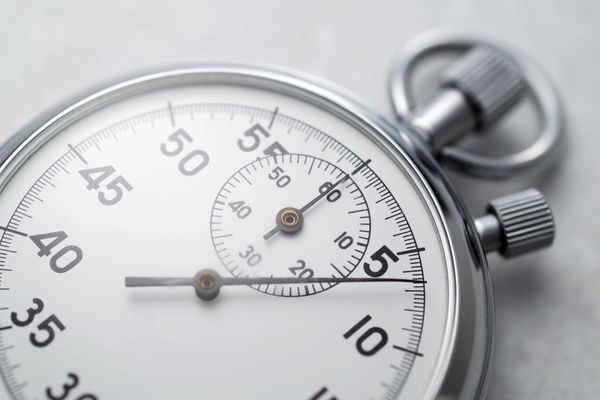 Close-up of a stopwatch highlighting the importance of timing when sending marketing emails.