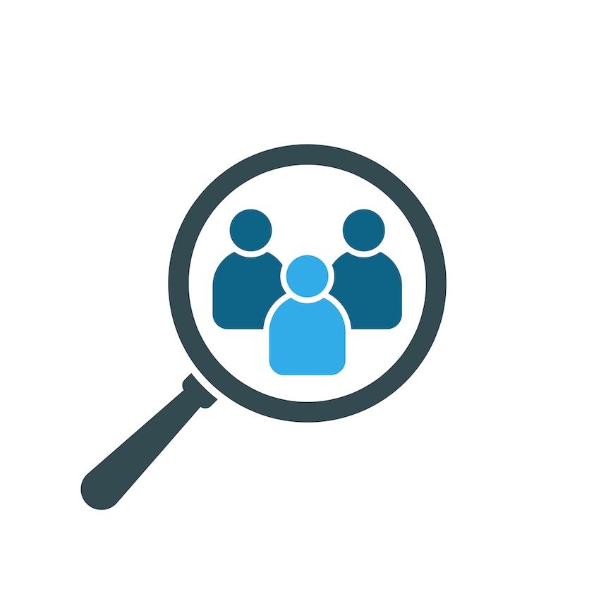 Magnifying glass focusing on a person icon, symbolizing analysis of best customers for targeted mail marketing success.
