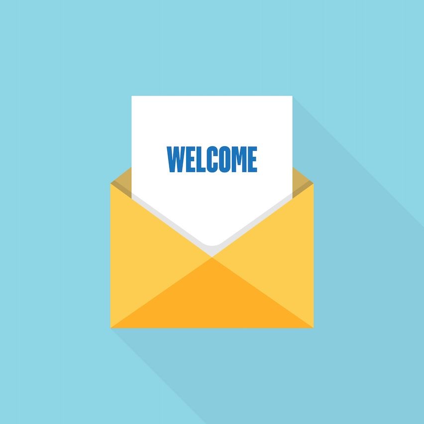 Open yellow envelope with 'welcome' on white paper inside, symbolizing a welcome email series.