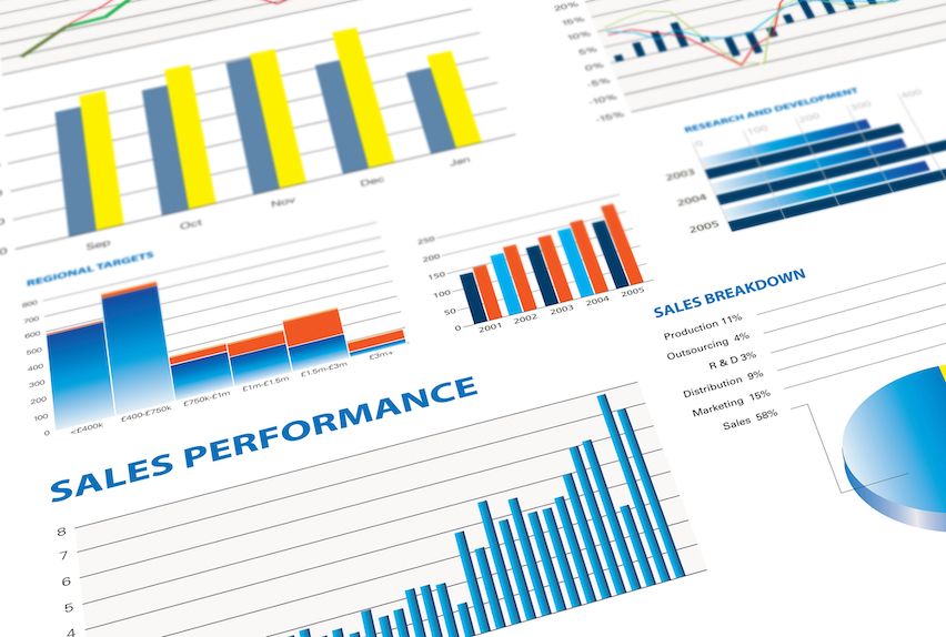 Analytics graphs on a screen showing sales performance, illustrating tailored reports by email automation.